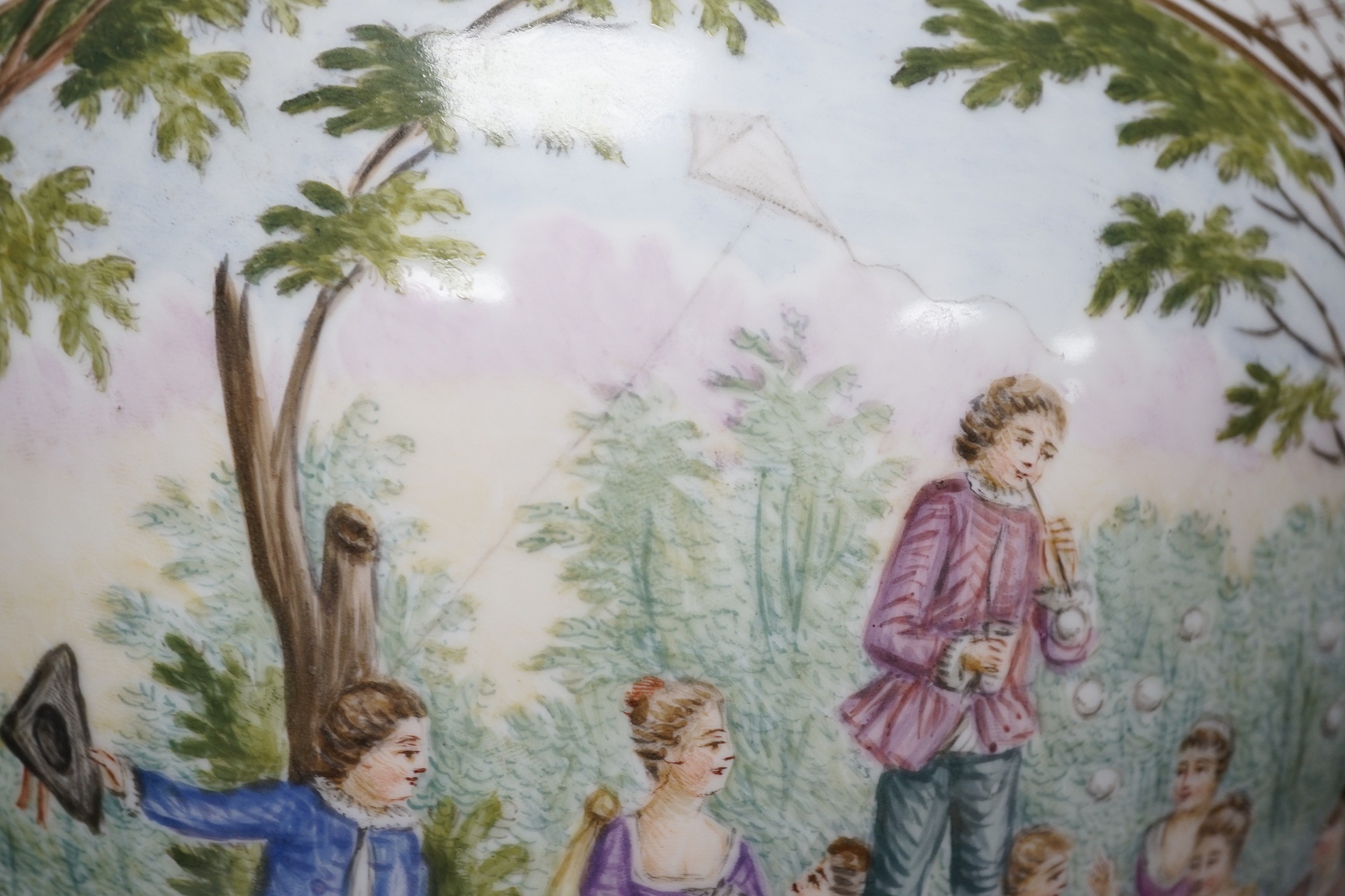 A large Helena Wolfsohn, Dresden vase and cover, from 1880, with a painted figural fishing cartouche one side and leisure activities the other, 52cms high